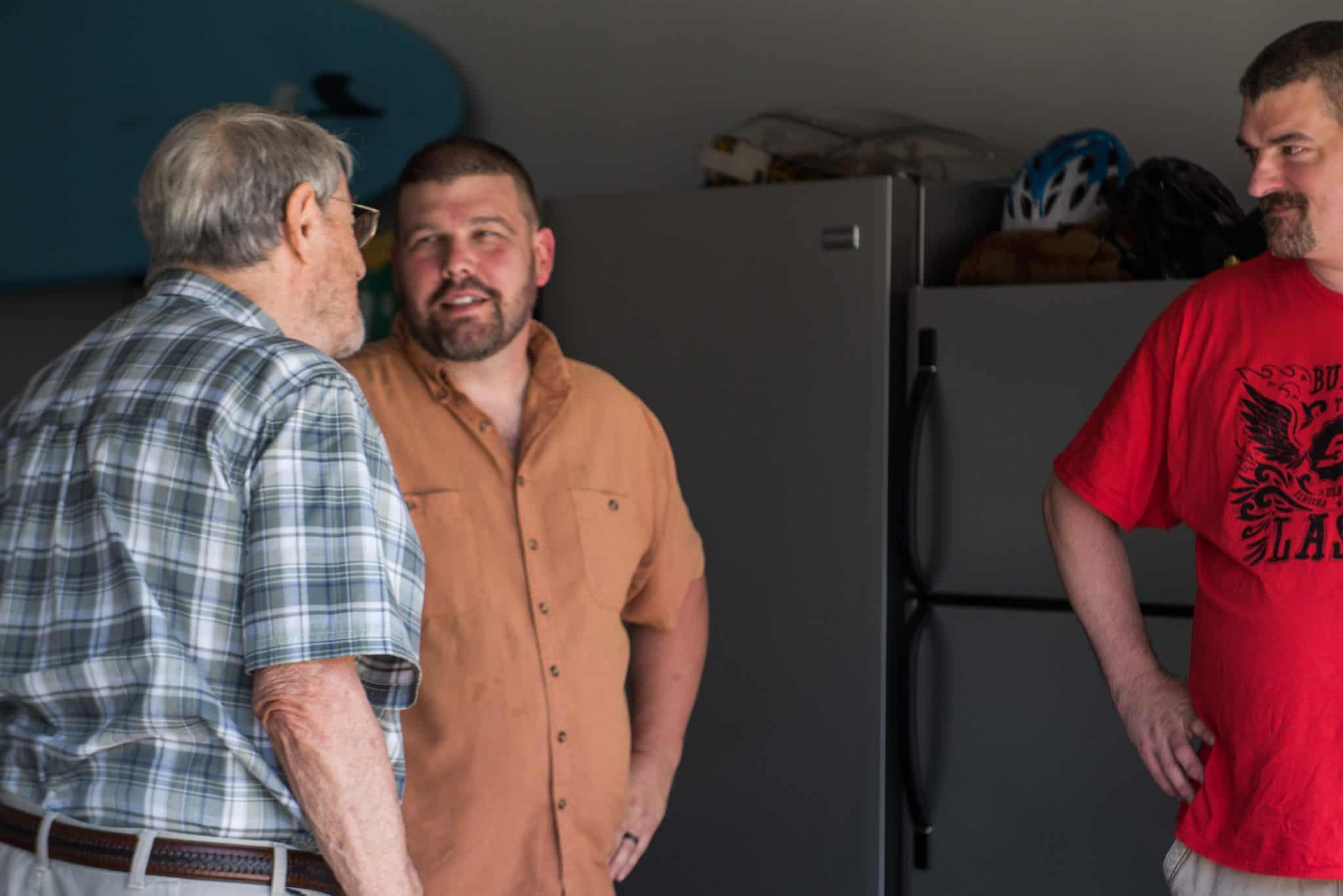 Apex employees chatting at the family cookout
