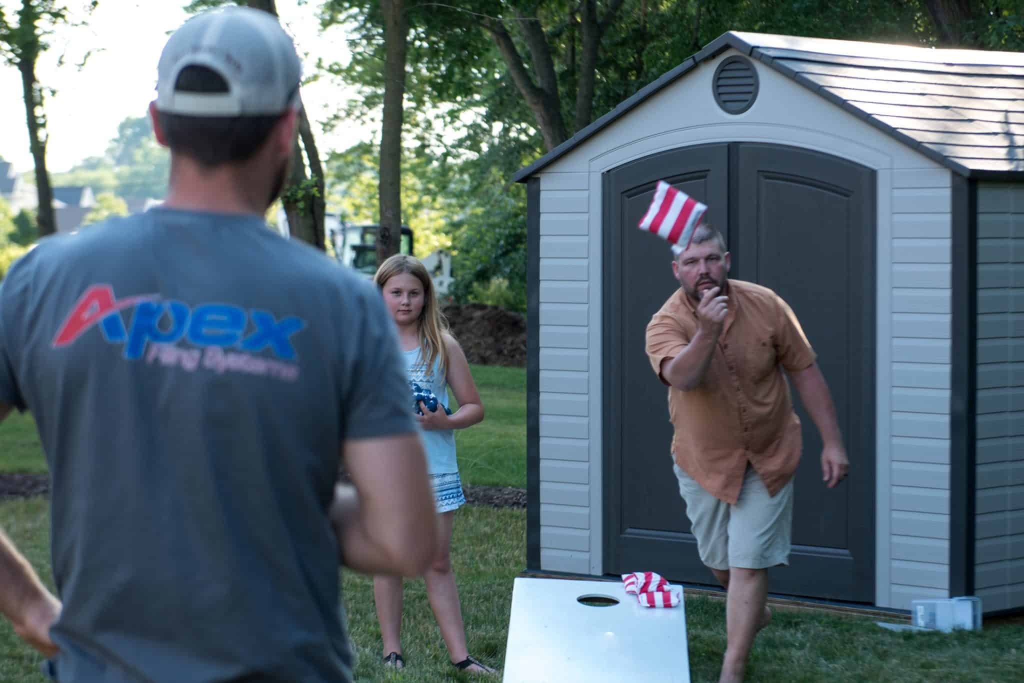 Playing bags at the Apex family cookout