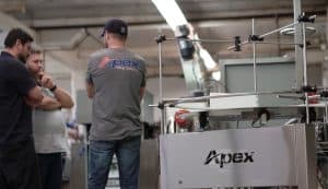 Apex employees discussing spare parts management