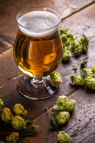 Glass of craft beer on a wood table
