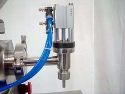Close up of a semi-automatic tabletop piston filler