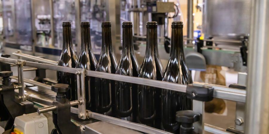 Wine bottles being filled