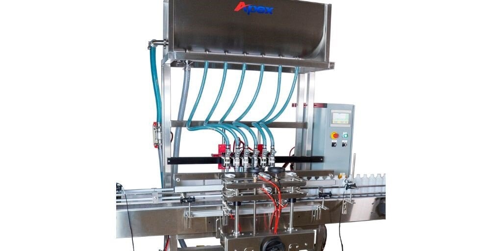 An Apex Filling Systems gravity filler in action, showcasing precise and efficient liquid filling for bottles and containers, ideal for food, beverage, and distilled spirits industries.